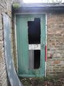 Thumbnail of 2060-1_2261 <br  /> General view of door to boiler room to the W of the cottage. No access 