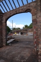 Thumbnail of Building A bay 3 arched entrance, view NW