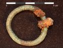 Thumbnail of Plate 18: Copper alloy annular brooch from the cemetery
