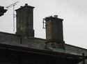 Thumbnail of Typical view of stone chimney stacks. Note poor cementatious render to lower stack