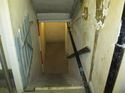 Thumbnail of View of concrete stairwell leading into basement (photograph taken from half landing)