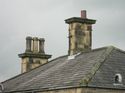 Thumbnail of Typical view showing roof and stone chimney stacks