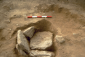 Thumbnail of Cist 5 showing collapsed capstones (scale 50cm)