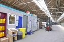 Thumbnail of Former vehicle storage shed 20, interior with modern office cabin