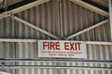 Thumbnail of Shed 20, red and white MOD fire exit sign c.1960s