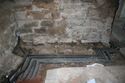 Thumbnail of Plate 14: Removal of Flags in West End of Crypt Bar for Services and Showing Thickened Out Foundation Wall 