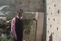 Thumbnail of <em>Tasos Tanoulas standing on the south wall of the older propylon upper courtyard.</em> <br  />(op000001.jpg)