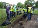 Thumbnail of Community volunteers and students have site tour led by the site manager, Nick Overton