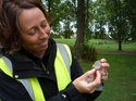 Thumbnail of One of the site Directors, Prof Sian Jones, with the Edward VII Coronation Medallion