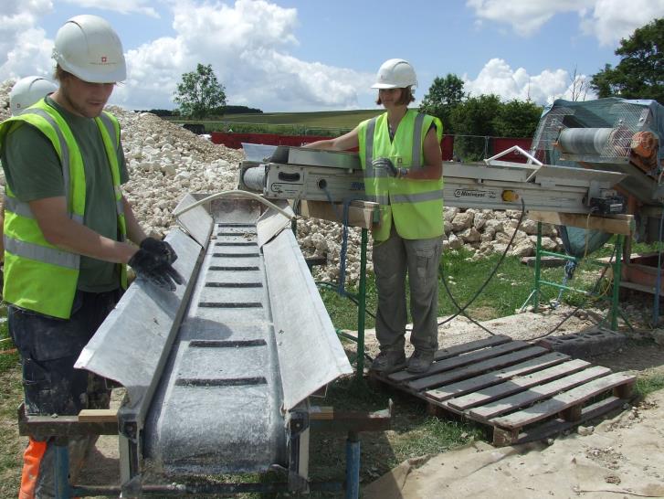 Progress shot of work on the conveyor-searching for finds through the chalk ©English Heritage