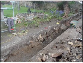 Photograph showing excavation trench with rubble features