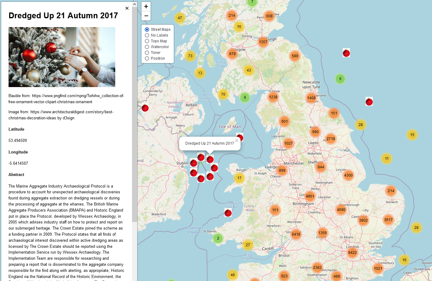 Current version of the library map showing a sidebar and thousands of clustered points. Both the points and sidebar include baubles to give a more festive feeling to the map.