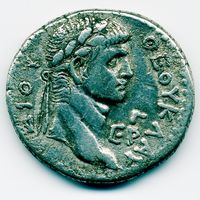 Photograph of a silver coin with the head of Claudius minted in Syria