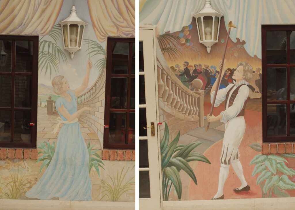 Details of the two figures lighting and snuffing lanterns which demonstrate the composition’s use of existing building fixtures