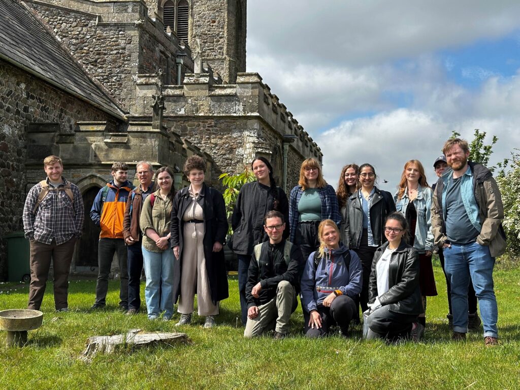 an image of ADS Staff visiting Skipsea standing outside a church