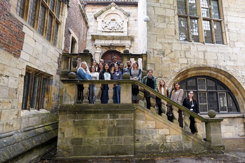 Image of MAIA participants posing on the steps of kings manor