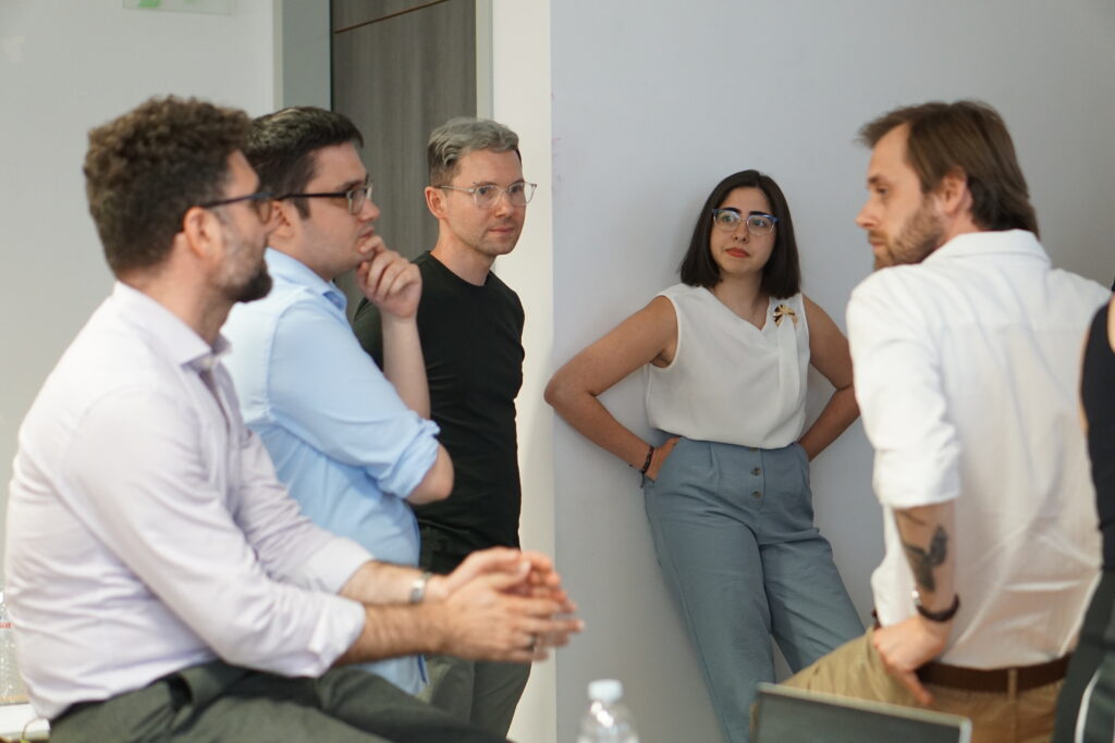 Five people in discussion 