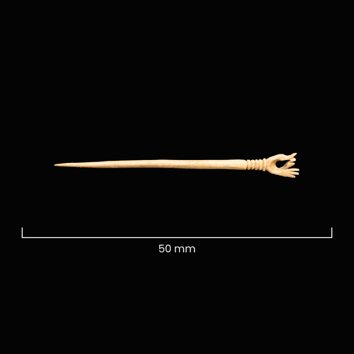 A bone pin measuring 50mm with a carved hand on one end 