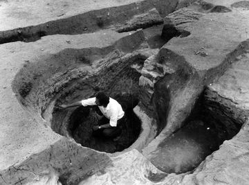 Charles S B Young excavating a possible medieval malt kiln at Boots Garage in 1972; © Nottingham City Museums and Galleries