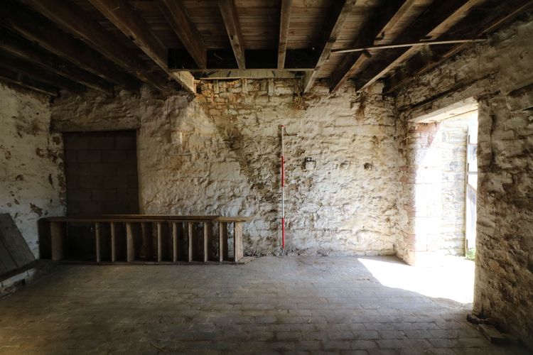 Thumbnail of Figure 19 and 66 Interior of cowshed Room B4 looking east with original timber ladder stairs