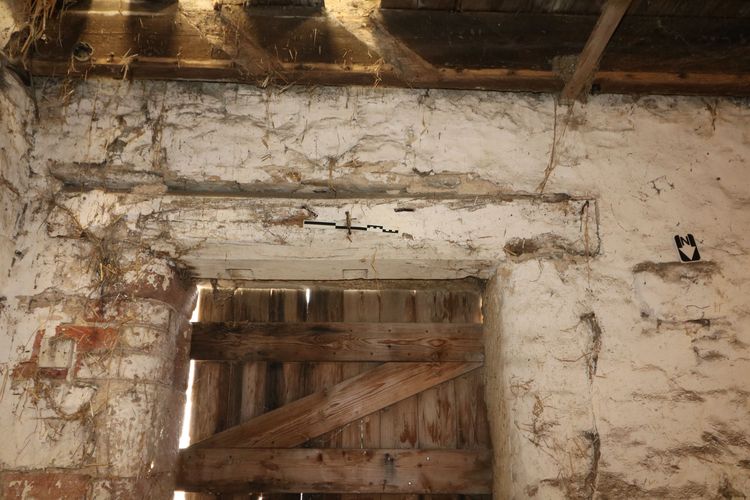 Thumbnail of Figure 21 and 70 Reused lintel to southern doorway of Room B5 looking south