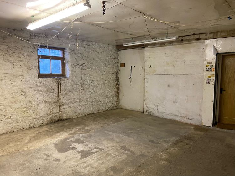 Thumbnail of Figure 24 and 74 Modern window and blocked doorway between Room B5 and Range C looking southeast