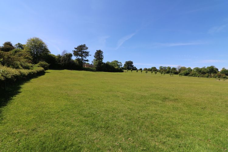 Thumbnail of Figure 5 and 32 Landscape setting of the U-shaped outbuilding viewed from the southeast