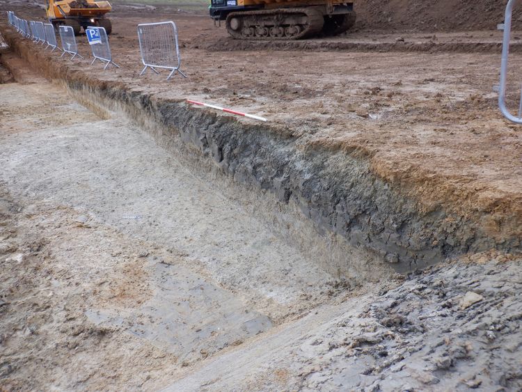 South-west facing oblique shot of the geoarchaeology trench at Versions Farm (2m scale)