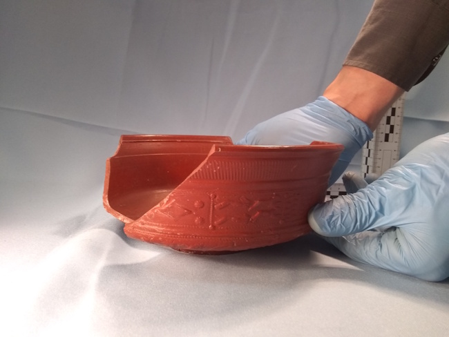 Photograph of a near-complete Drag 29 terra sigillata bowl in the London Museum.
