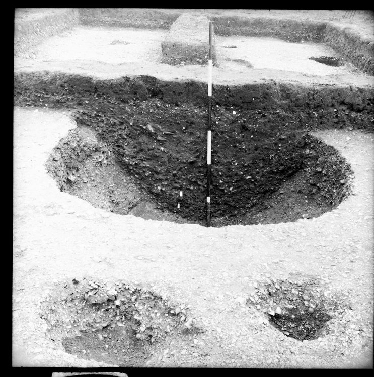 Thumbnail of 12-1 View looking E of Pit I in trench AII with scale