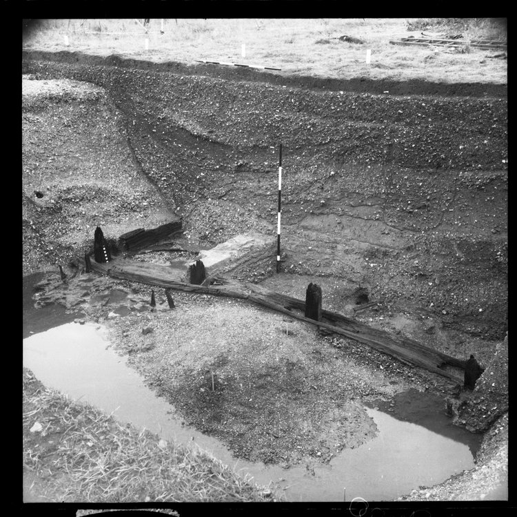 Thumbnail of 27-6 View looking NW of Beam A and N section of Great Ditch I with scale