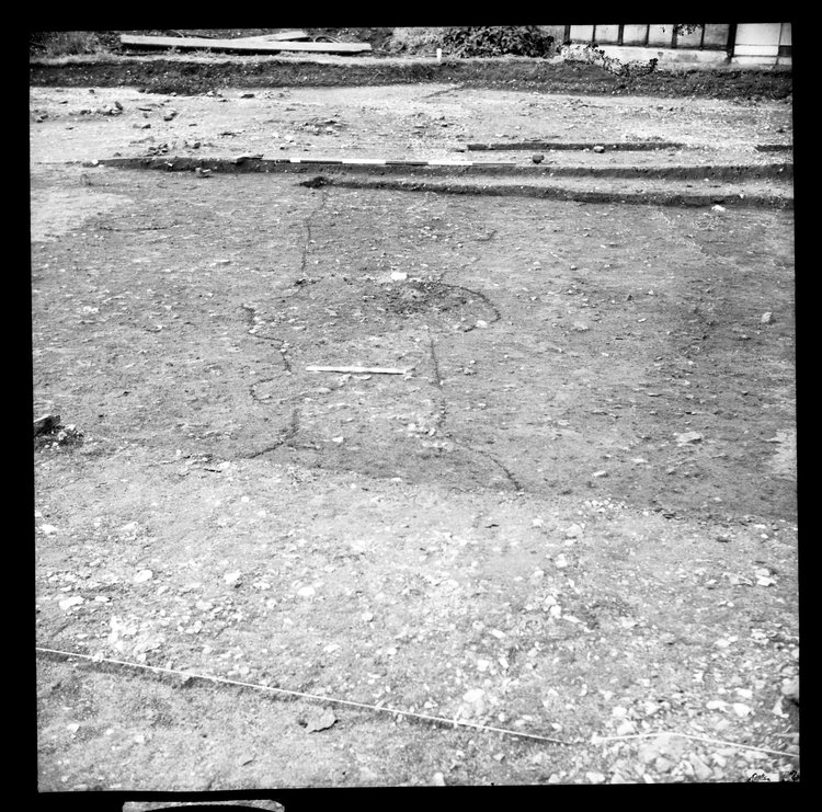 Thumbnail of 36-5 View looking N of feature in IDX before excavation with scale