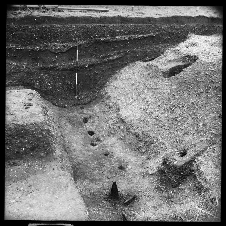 Thumbnail of 43-2 - View looking S of Great Ditch I S section with scale during excavation