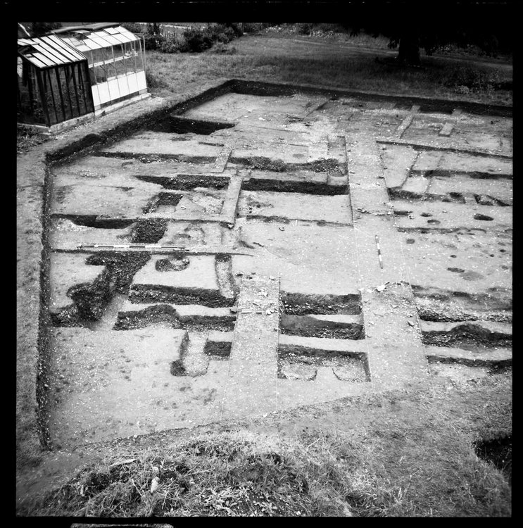 Thumbnail of 46-2 View looking NE of IDX fully excavated with archaeologists and scale