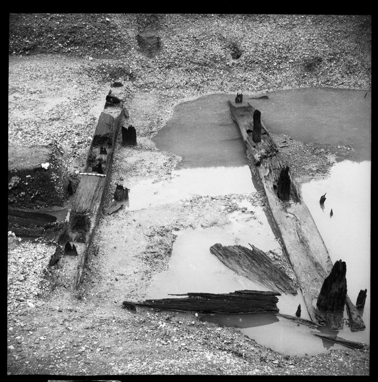 Thumbnail of 49-2 Close up looking W of Beams A and B in Great Ditch II middle section fully excavated with scale