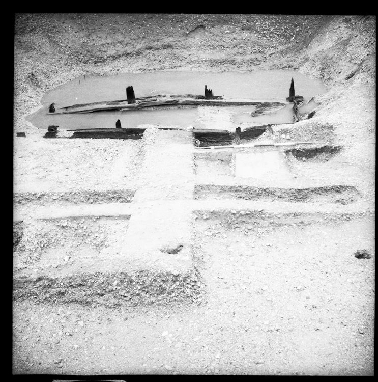 Thumbnail of 49-4 View looking S of Beams A B and C in Great Ditch II middle section fully excavated with scale