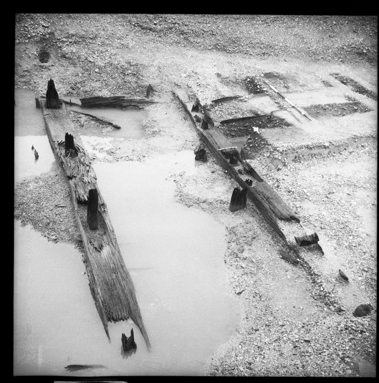Thumbnail of 49-6 Close up looking W of Beams A and B in Great Ditch II middle section fully excavated with scale