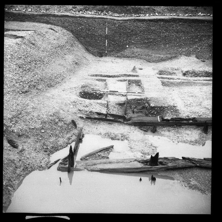 Thumbnail of 49-9 View looking N of Beams A B and C in Great Ditch II middle section fully excavated with scale