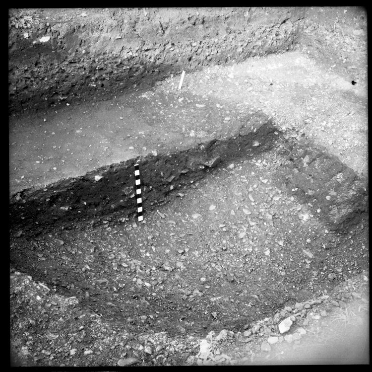 Thumbnail of 5-2 Close up of pit on N edge of AII during excavation with scale