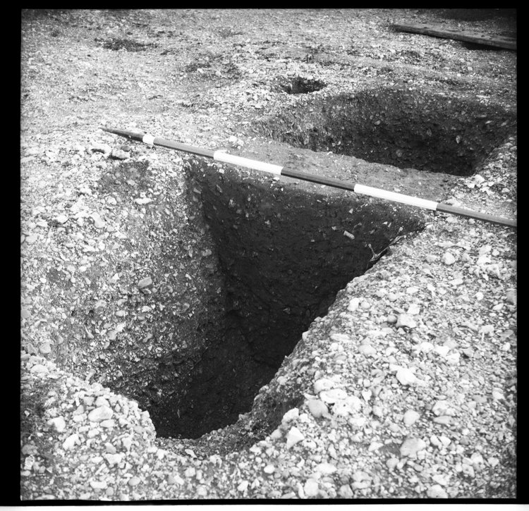 Thumbnail of 54-11 View looking SW grave-like feature in OD 1 including section with scale