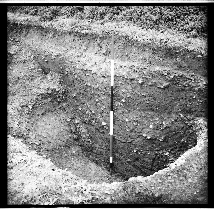 Thumbnail of 54-7 View of Pit i in Trial Trench OD 1 including section with scale