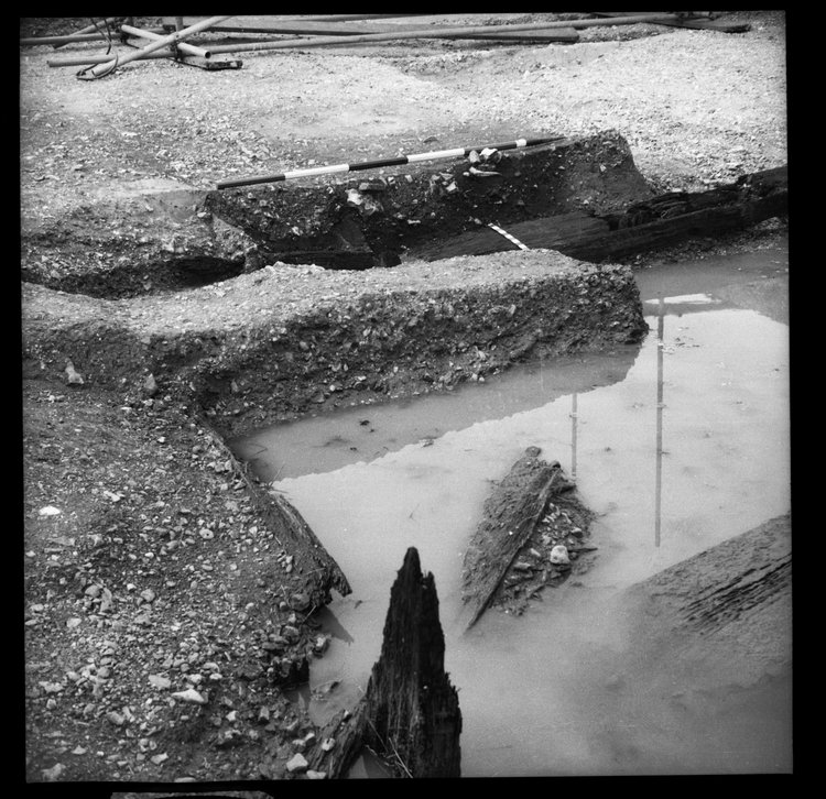 Thumbnail of 56-2 Close up looking NE of Beam B and post from Beam A during excavation in Great Ditch II with scale