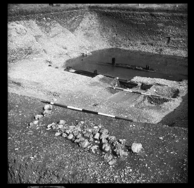 Thumbnail of 58-2 View looking SE of Great Ditch II during excavation with scale