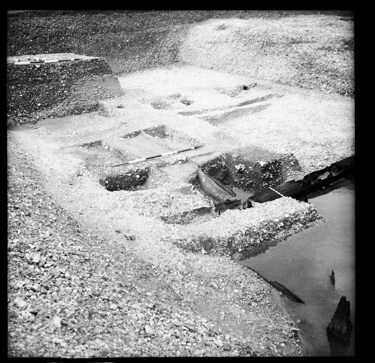 Thumbnail of 58-4 View looking NE of Great Ditch II during excavation with scale, including Beams B and C,