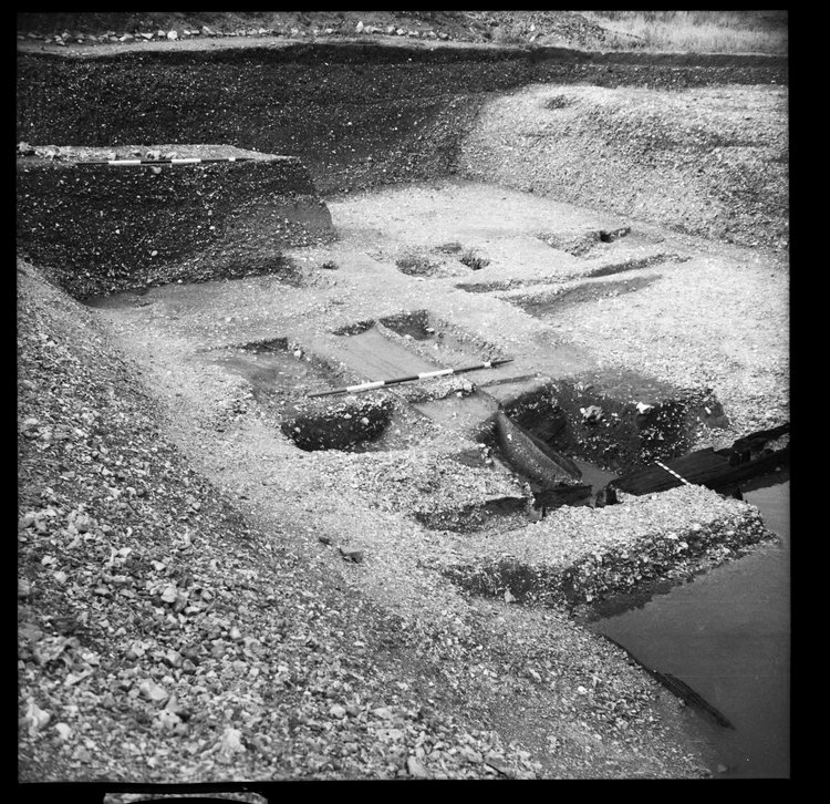 Thumbnail of 58-5 View looking NE of Great Ditch II during excavation with scale, including Beams B and C