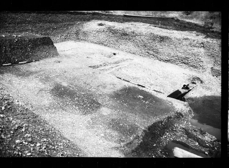 Thumbnail of 69-6 View looking NE of Beams A and B during excavation in GD II with scale