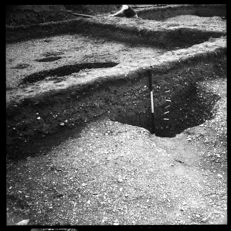 Thumbnail of 8-2 View looking NW of Pit I in trench II with scale