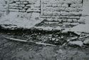 Thumbnail of 1968 black and white photograph showing standing wall and excavated linear stone feature, West Front.