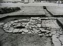 Thumbnail of 1972 black and white photograph of Trenches B1-B2, Site XXIII (Outer Courtyard), looking west, showing semicircular tower footing.
