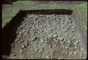 Thumbnail of 1974 photograph of square trench in Area B, Site XXIII (Outer Courtyard), showing stone scatter.